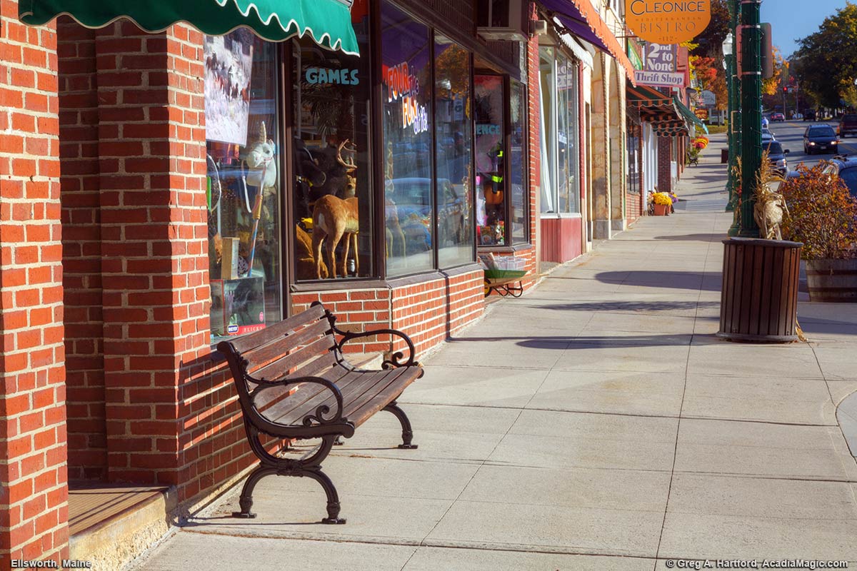 Bench on sidewalk of Main Street in Ellsworth, Maine